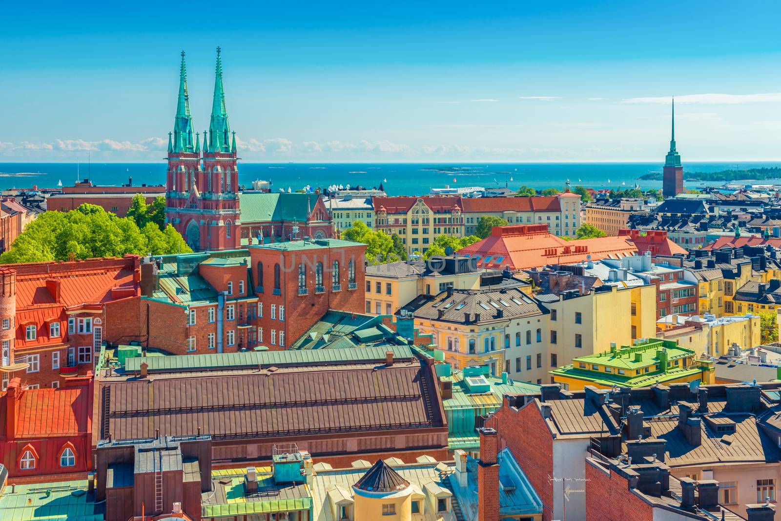 Aerial panorama of Helsinki. Cityscape of the Capital of Finland with Baltic Sea in the background. Colorful houses in the traditional Scandinavian architecture style