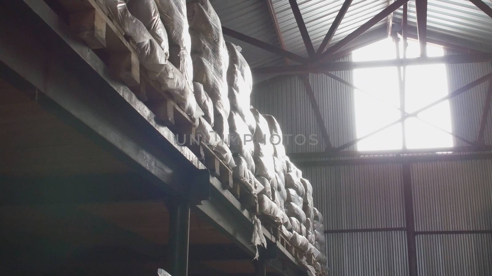 Shelves of cardboard boxes inside a storage food warehouse, wide angle