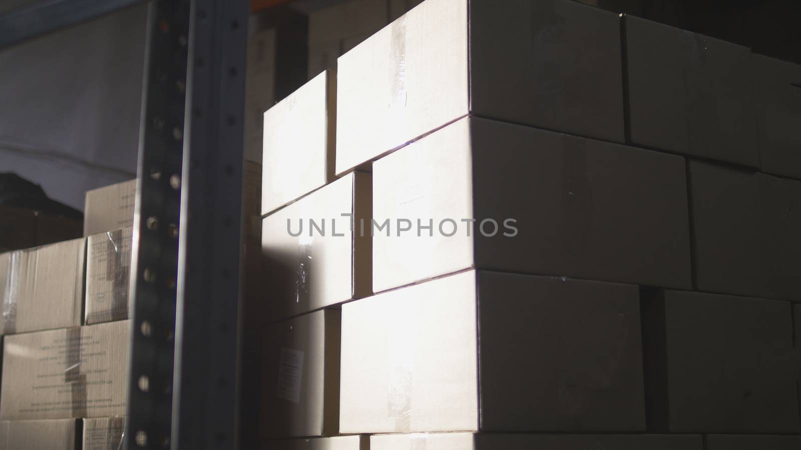 Cardboard boxes inside a large warehouse, wide angle