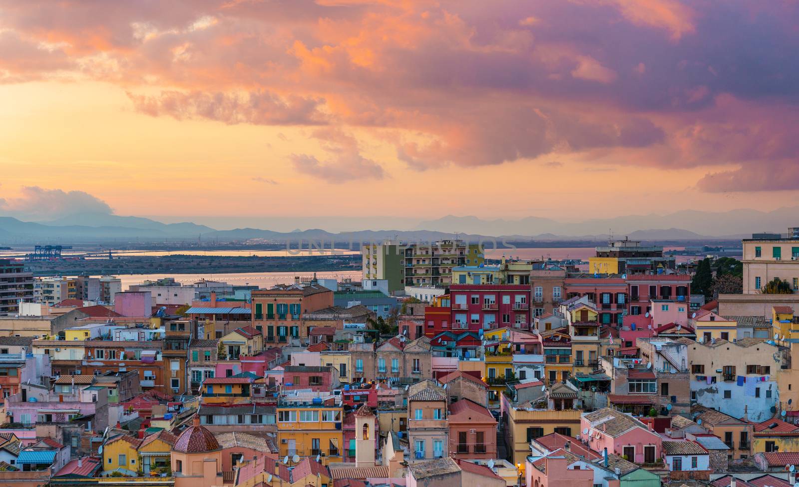 Sunset on Cagliari, aerial panorama of old city center with old colored houses in Sardinia's capital, Italy