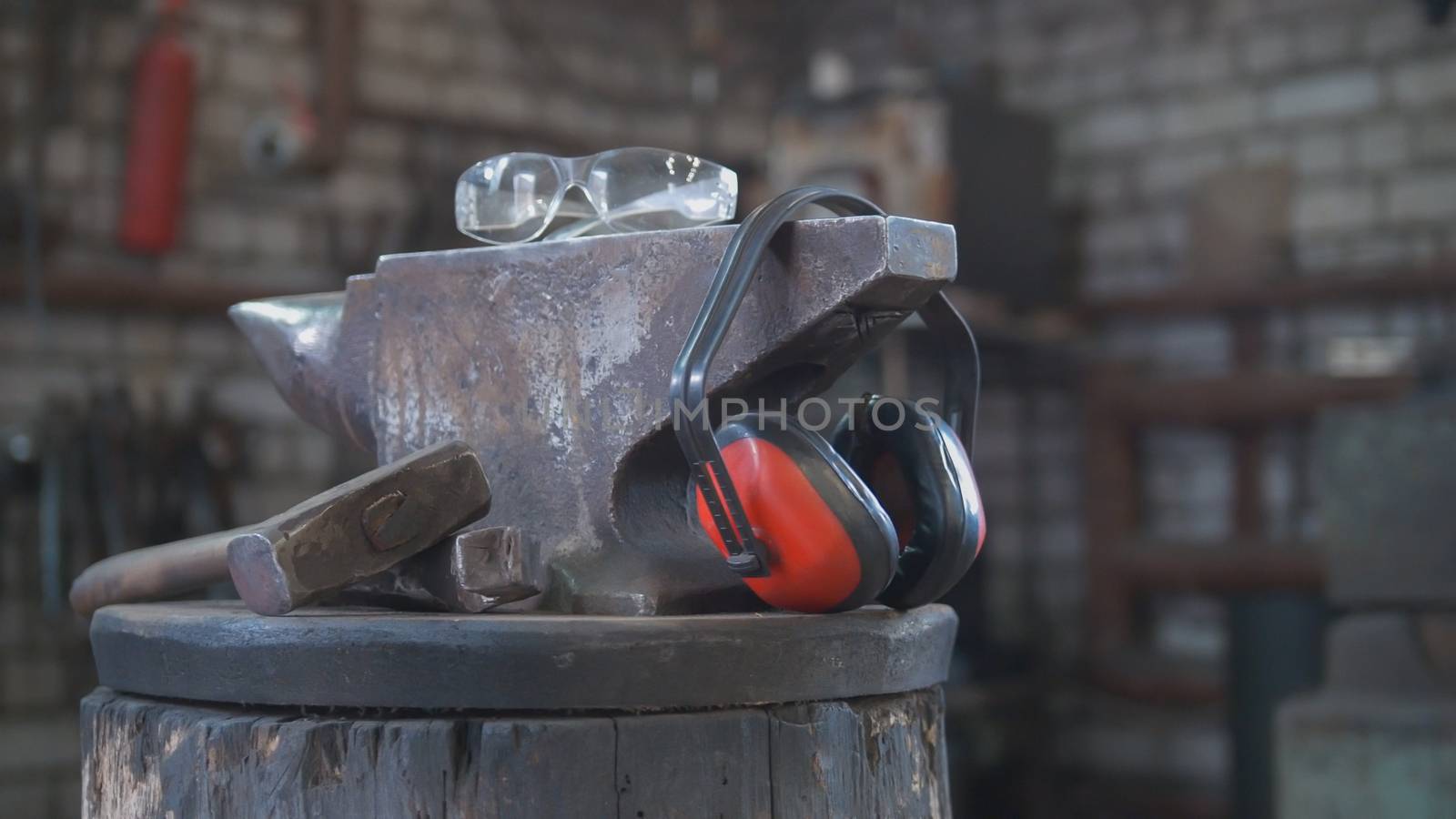 Forge workshop - hammer, anvil and protect headphones by Studia72