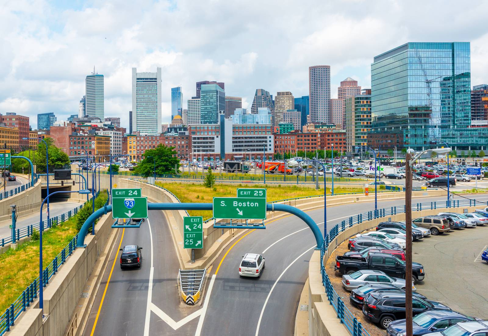 Boston - June 2016, MA, USA: Boston skyline in summer day, panoramic view on buildings in downtown and highway with traffic