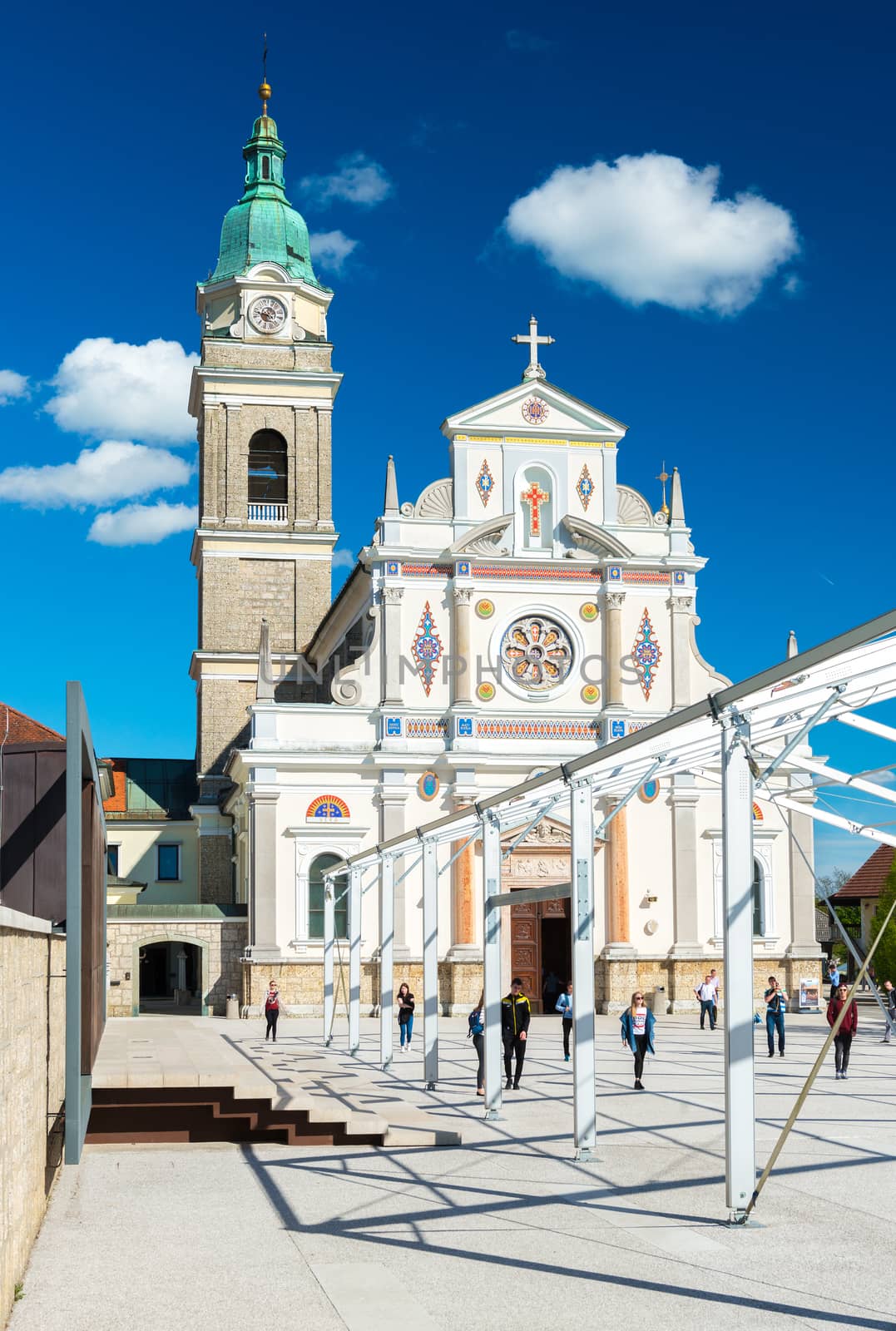 Brezje - May 2017, Slovenia: The Basilica of St. Mary Help and people walking around