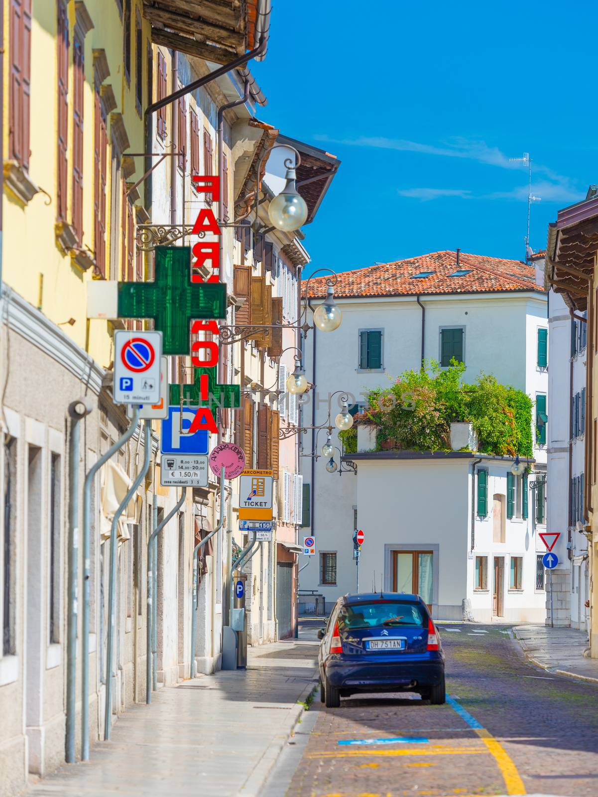 Udine - August 2016, Italy: Street view with car parked near the Pharmacy store