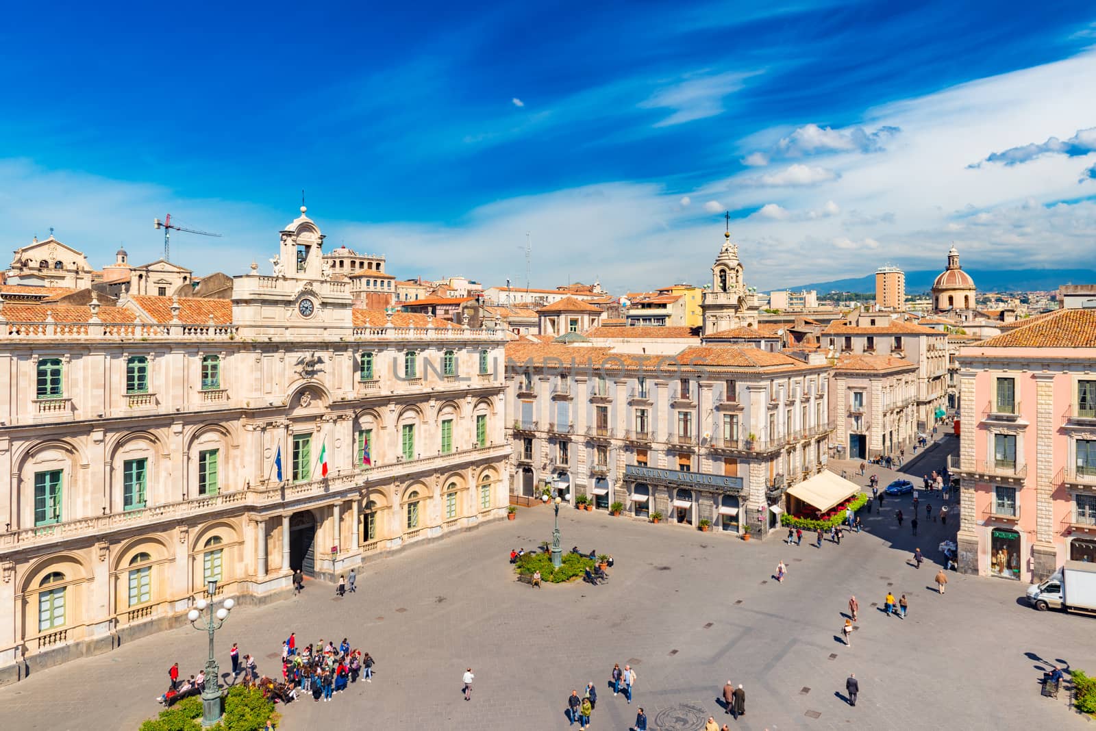 Catania - April 2019, Italy: Cityscape of Catania in the morning. People walking on the main square in the historical city center