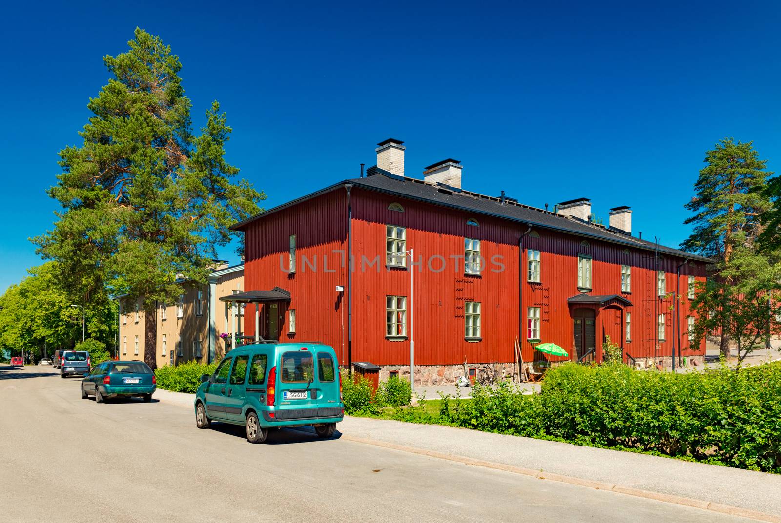 Helsinki - June 2019, Finland: Red wooden house in the traditional finnish architectural style