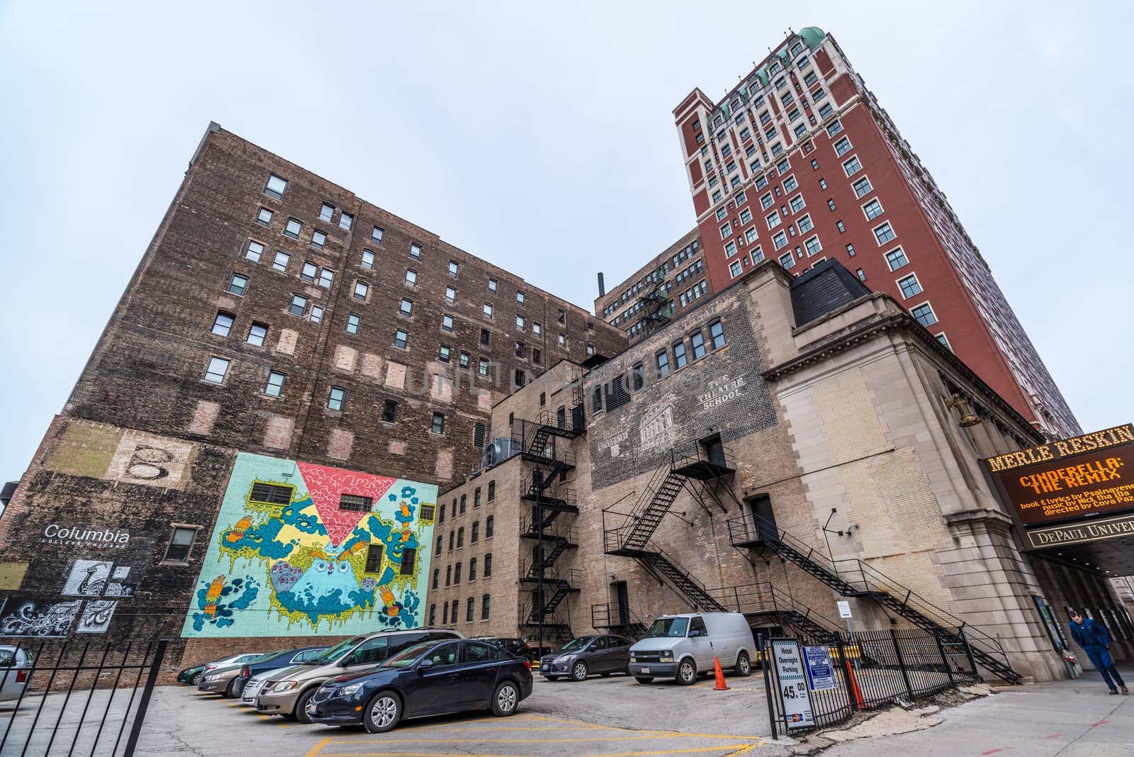 Chicago - March 2017, IL, USA: Car parking in downtown Chicago (DePaul University - Merle Reskin Theater, Spirit of Music Garden in Grant Park)