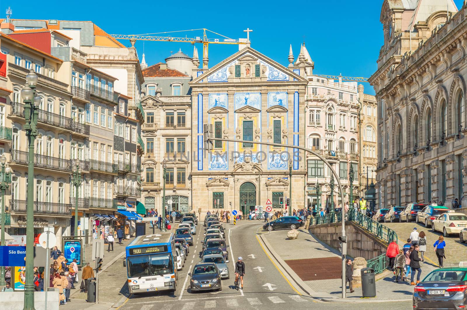 Porto - February 2019, Portugal: View of the Saint Anthony's Church (Igreja de Santo António dos Congregados) in Porto city center, near São Bento station. A street with car traffic and walking people