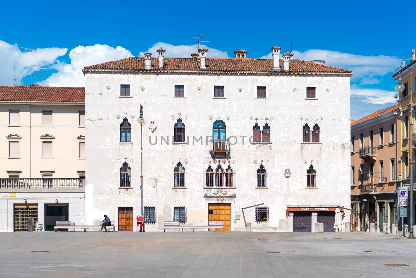 Udine - May 2016, Friuli-Venezia Giulia region, Italy: Typical Italian house in Venetian style on the square of Udine in sunny day with blue sky
