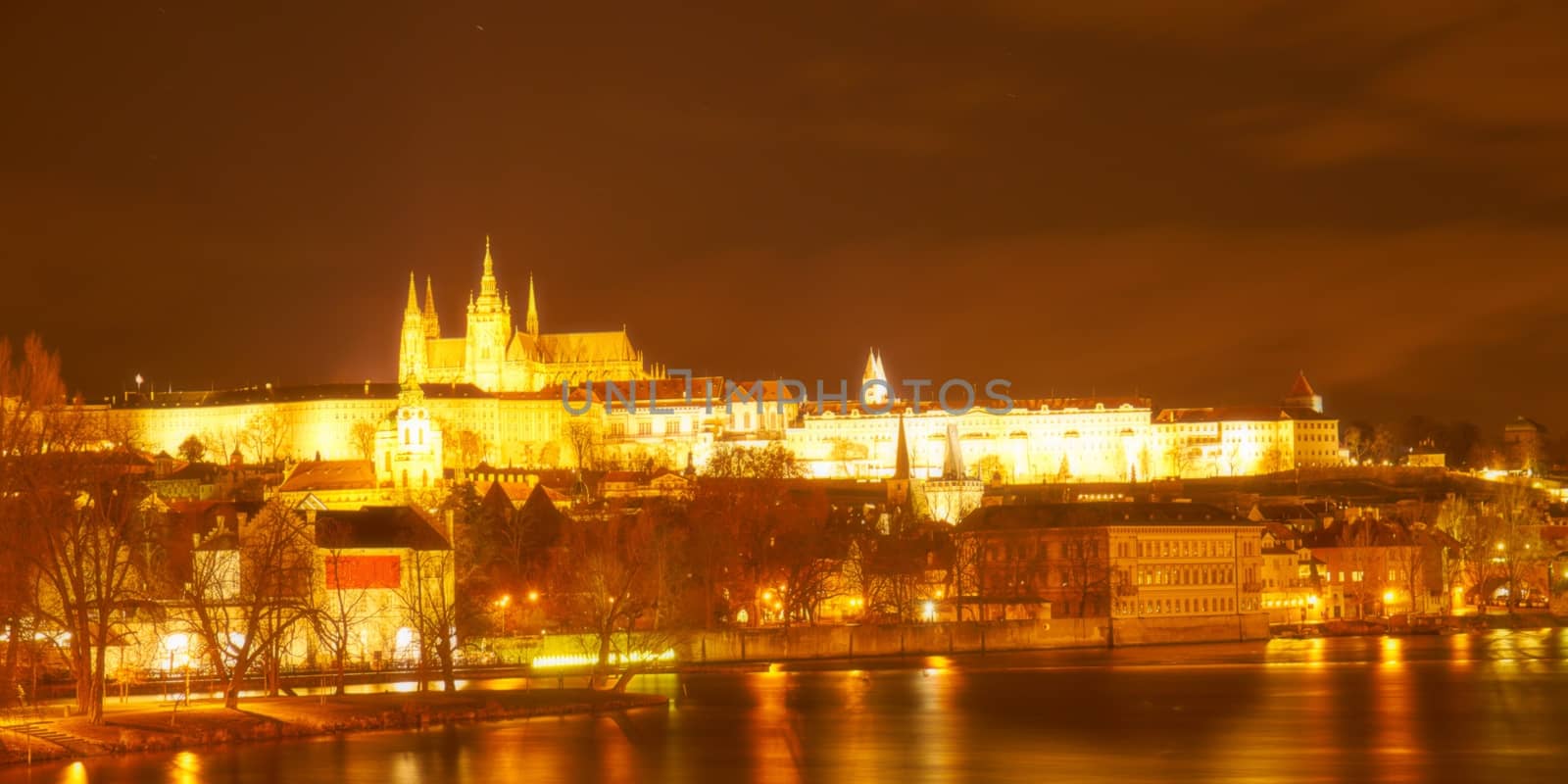 Night view of historical Prague with the Prague castle and Charles bridge