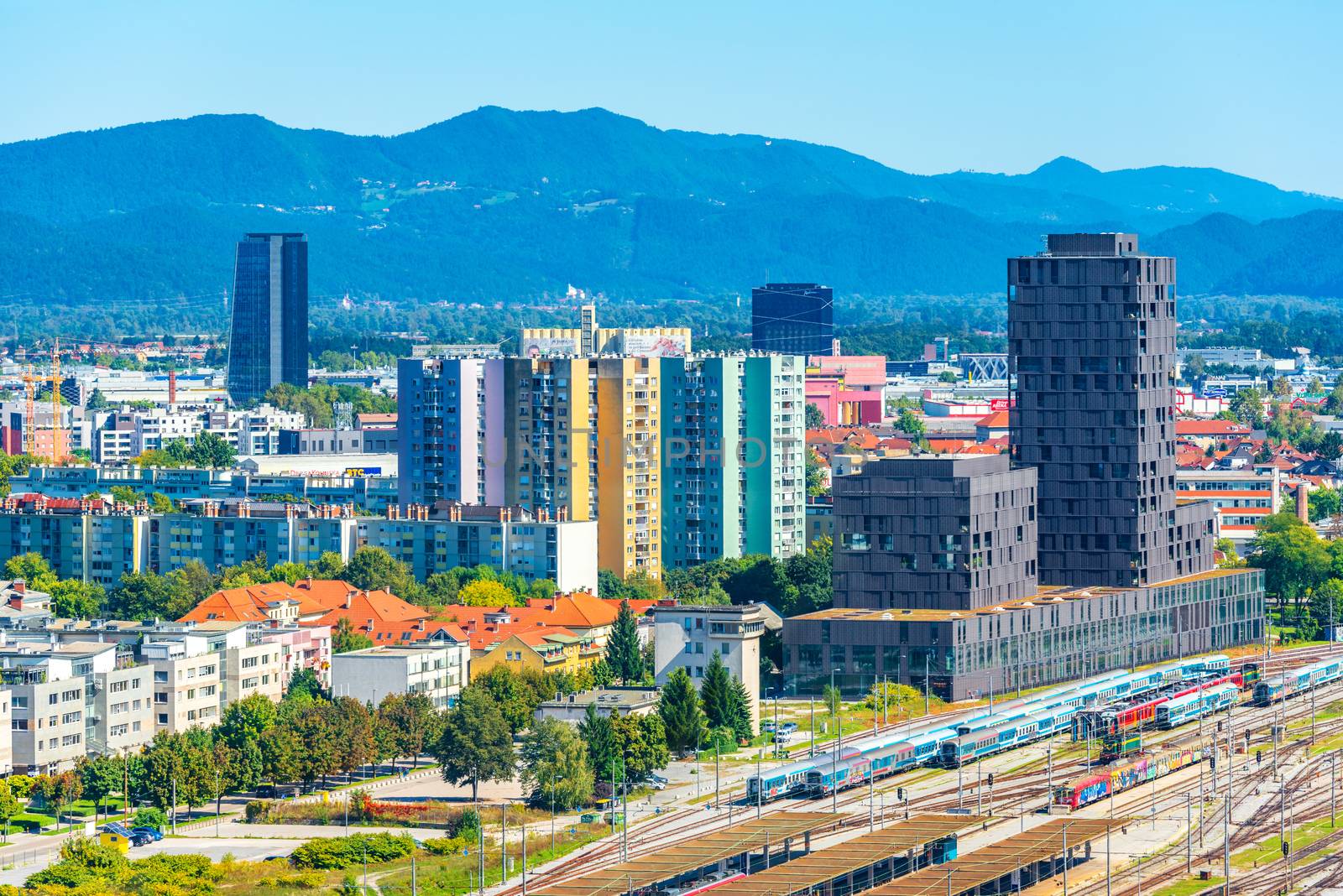 Ljubljana - September 2019, Slovenia: Aerial panorama of Ljubljana with the main train station, modern architecture and picturesque hills in the background