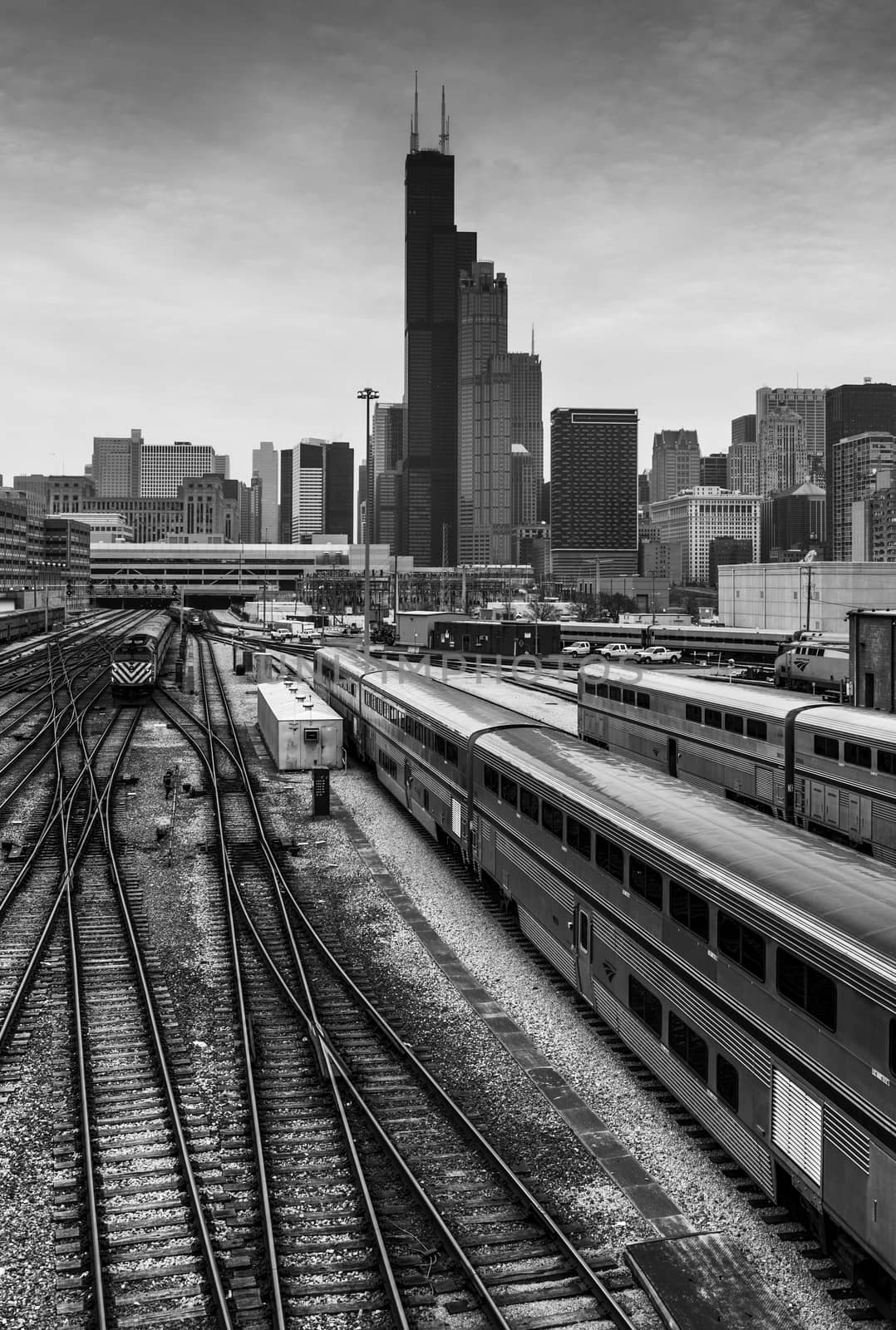 Chicago - March 2017, IL, USA:  View of downtown Chicago, Willis Tower, surrounding buildings, railway and Amtrak trains