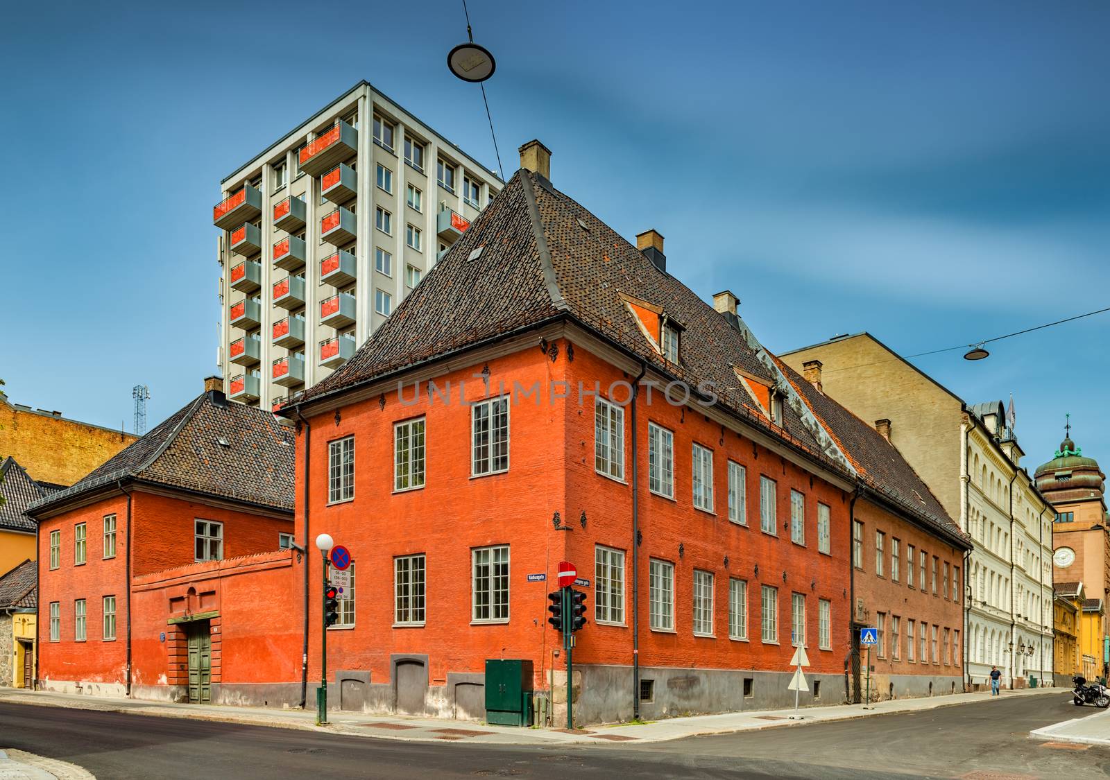 Oslo - June 2019, Norway: View of the  former City hall building in the central Oslo. Historical building with a stormy sky in the background