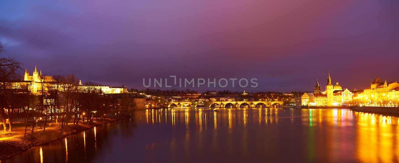 Night view of historical Prague with the Prague castle and Charles bridge