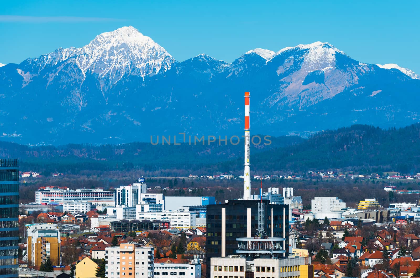 Ljubljana - March 2017, Slovenia: Ljubljana cityscape with snowy mountains on the background