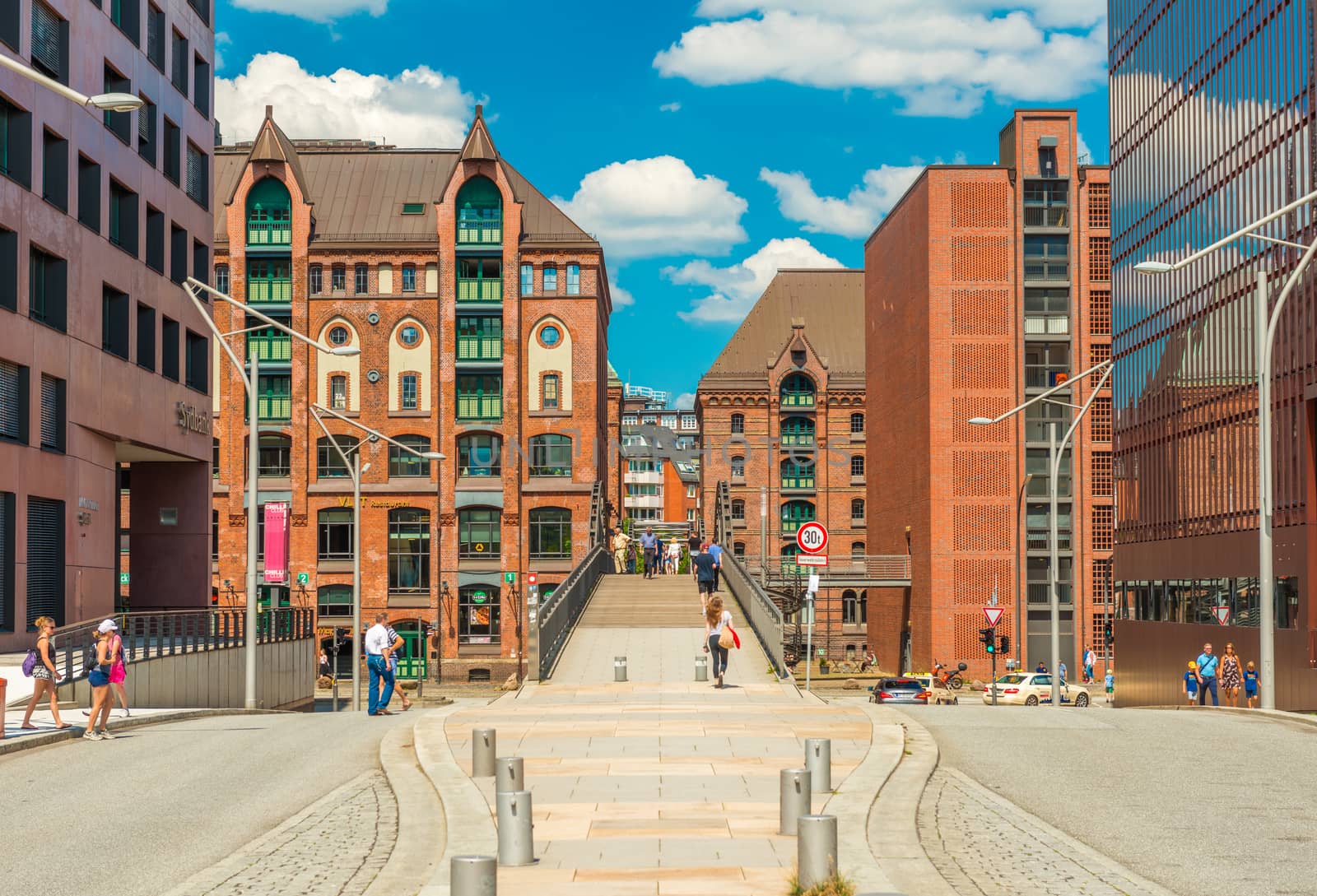 Hamburg - July 2018, Germany: People are walking around in the HafenCity neighbourhood, the famous district of Hamburg, popular tourist route