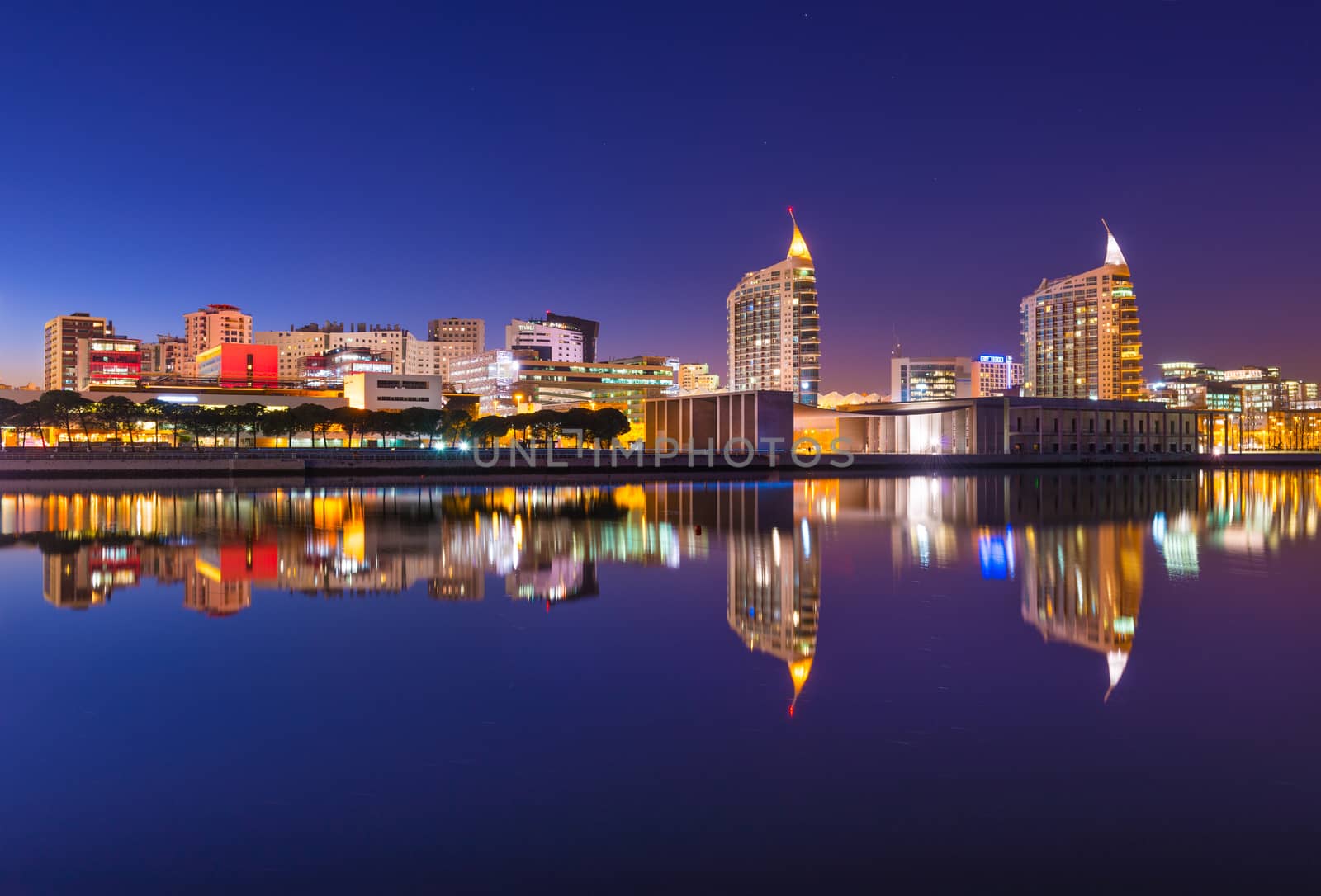 Lisbon - February 2019, Portugal: View of The Nations Park (Parque das Nações) in Lisbon. Modern cityscape mirrored in the water