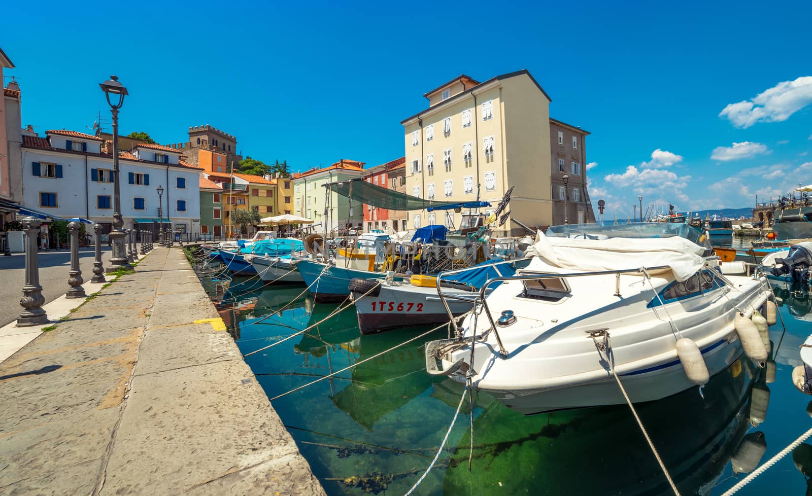 Muggia - July of 2014, Italy: Boats in harbor of the old city center in Muggia