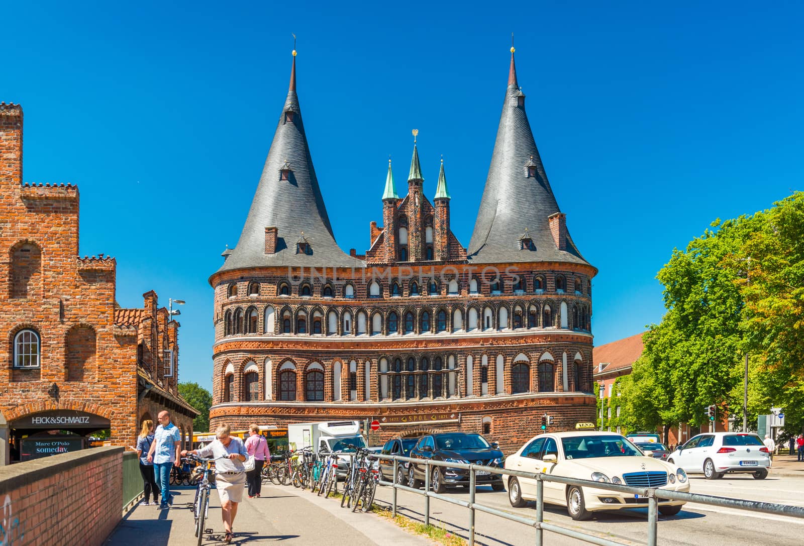 Lubeck - July 2018, Germany: The Holsten Gate (Holstentor). One of the famous landmarks of the old gothic town. Popular tourist destination, Schleswig-Holstein region