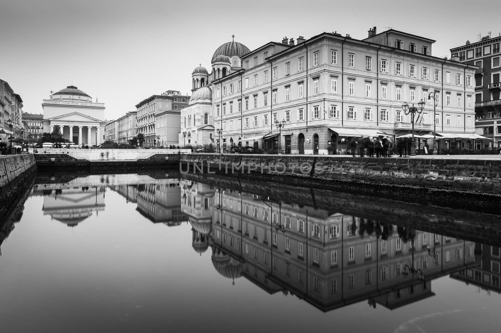 Trieste - December 2016, Italy: Mirror reflected historic buildings in the water canal situated in the center of the city, the famous landmark in Trieste (Northern Italy)