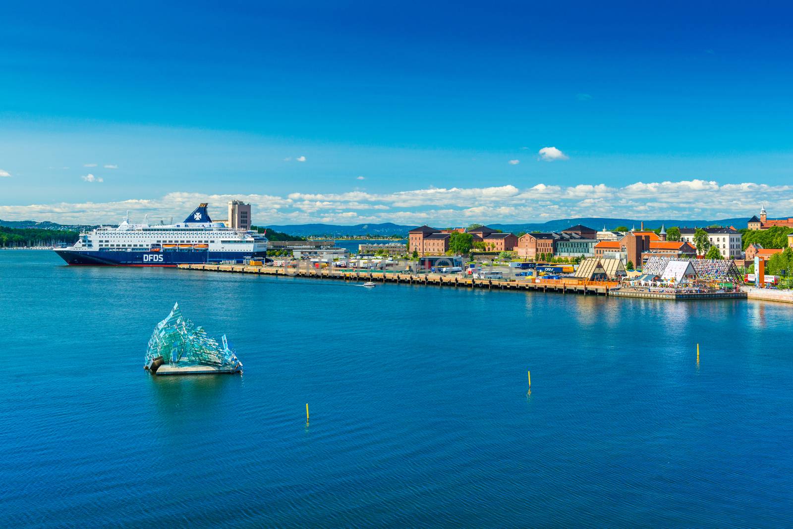 Oslo - June 2019, Norway: Beautiful aerial cityscape of the capital of Norway. Skyline with a cruise ship, modern sculpture and historical architecture