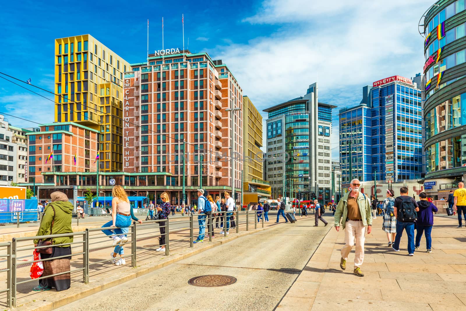Oslo - June 2019, Norway: View of downtown Oslo with modern buildings and walking people. Colorful architecture in the capital of Norway