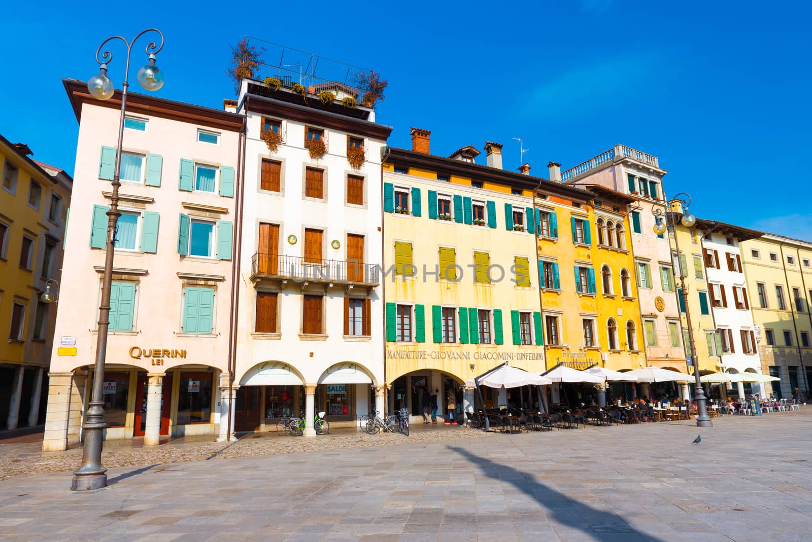 Udine - February 2017, Italy: View of the central square of Udine (Piazza San Giacomo). Colored residential houses in the traditional architecture style.
