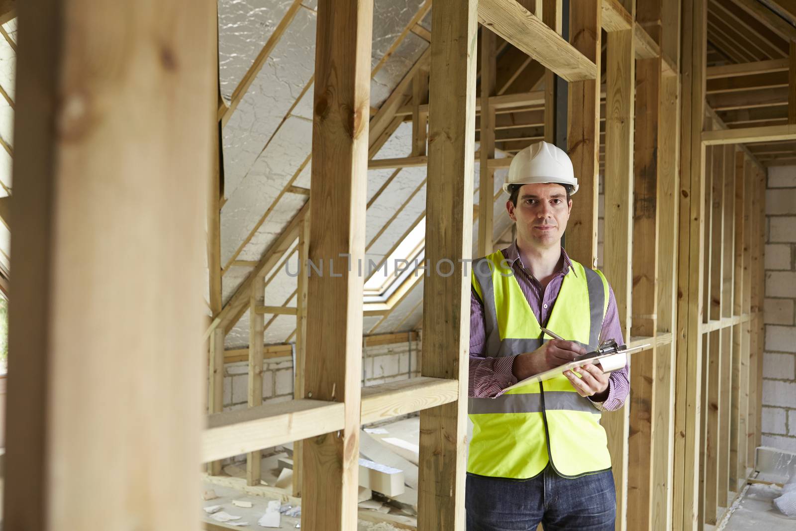 Building Inspector Looking At New Property