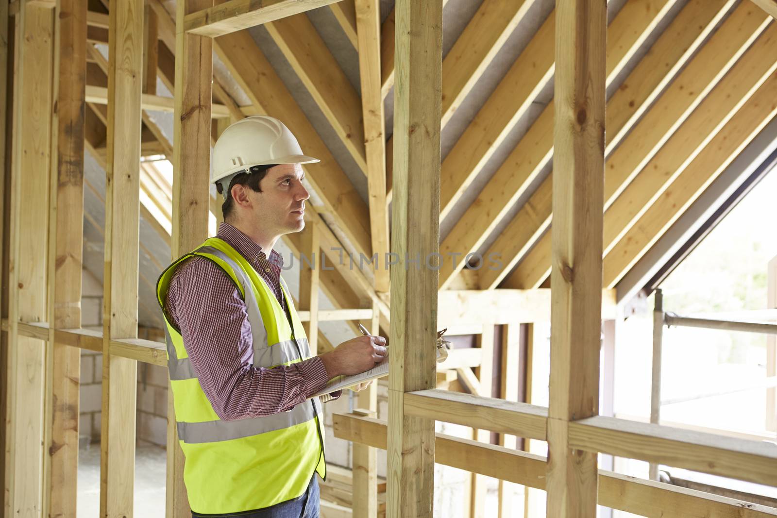 Building Inspector Looking At New Property