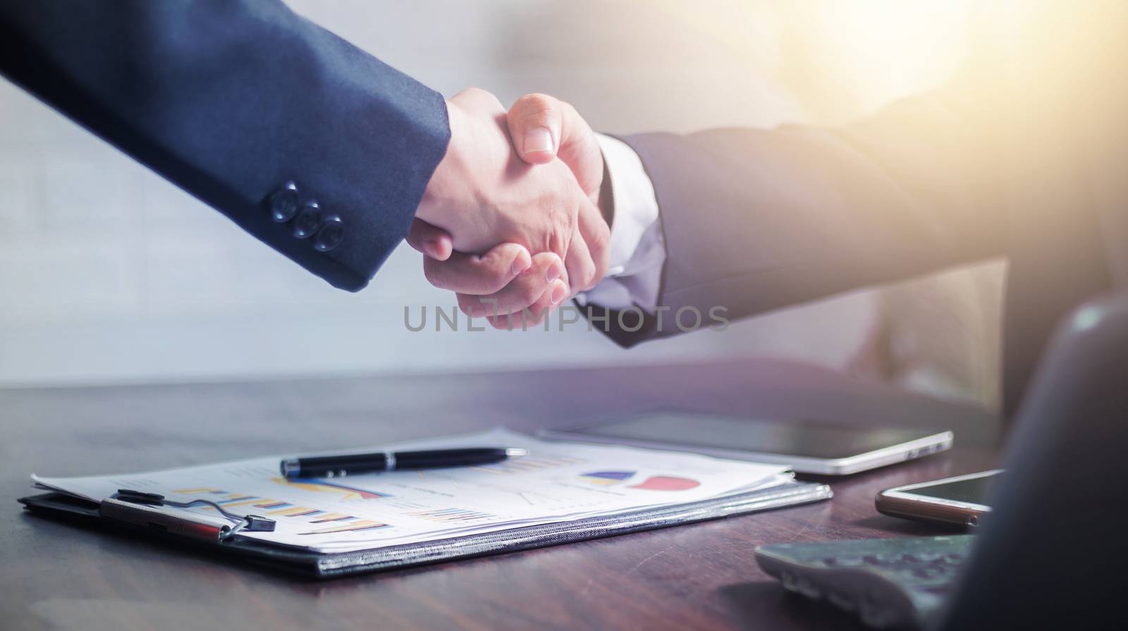 successful negotiate and handshake concept, two businessman shake hand with parthner to celebration partnership and teamwork, business deal 