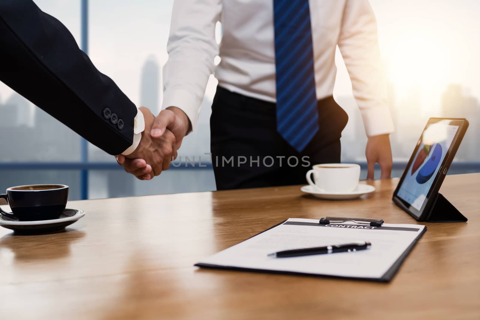 successful negotiate and handshake concept, two businessman shake hand with parthner to celebration partnership and teamwork, business deal	

