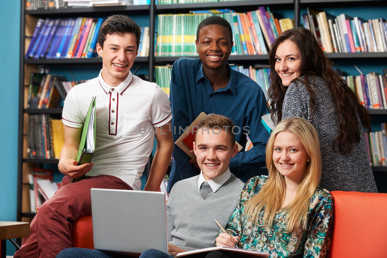 Portrait Of Happy Students In Library by HWS