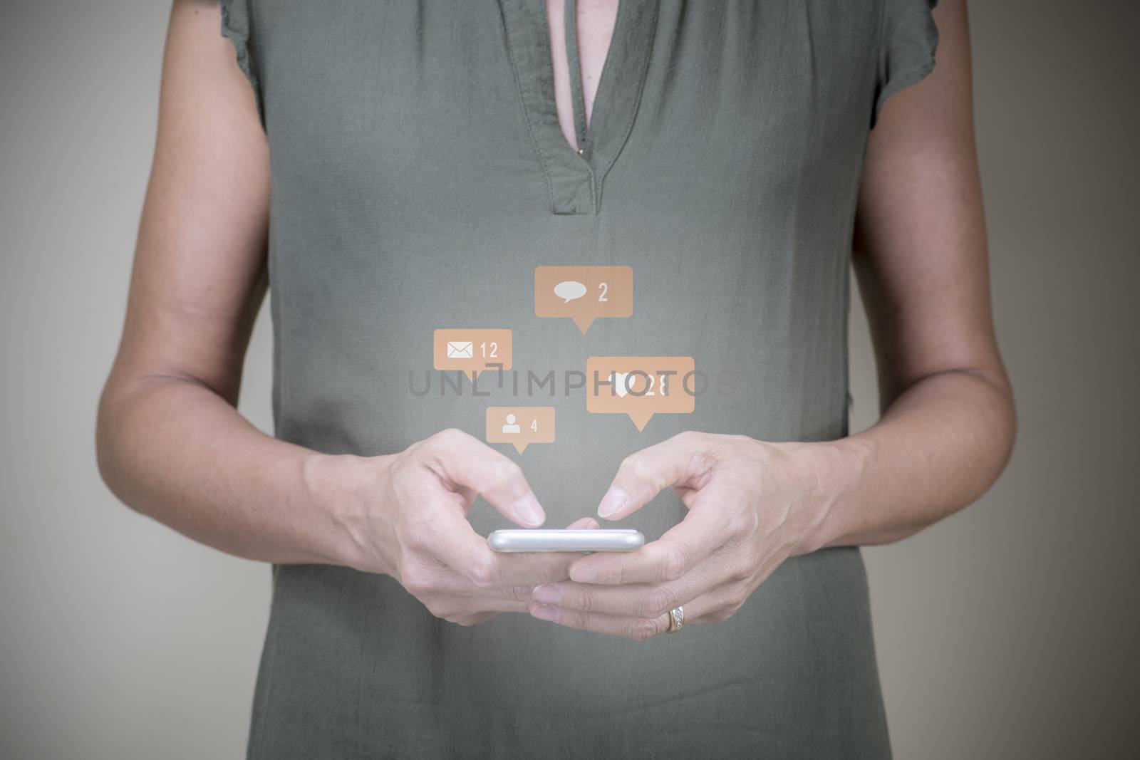 Woman interacting with her mobile and using online social media (elife), Marketing concept (light blur)