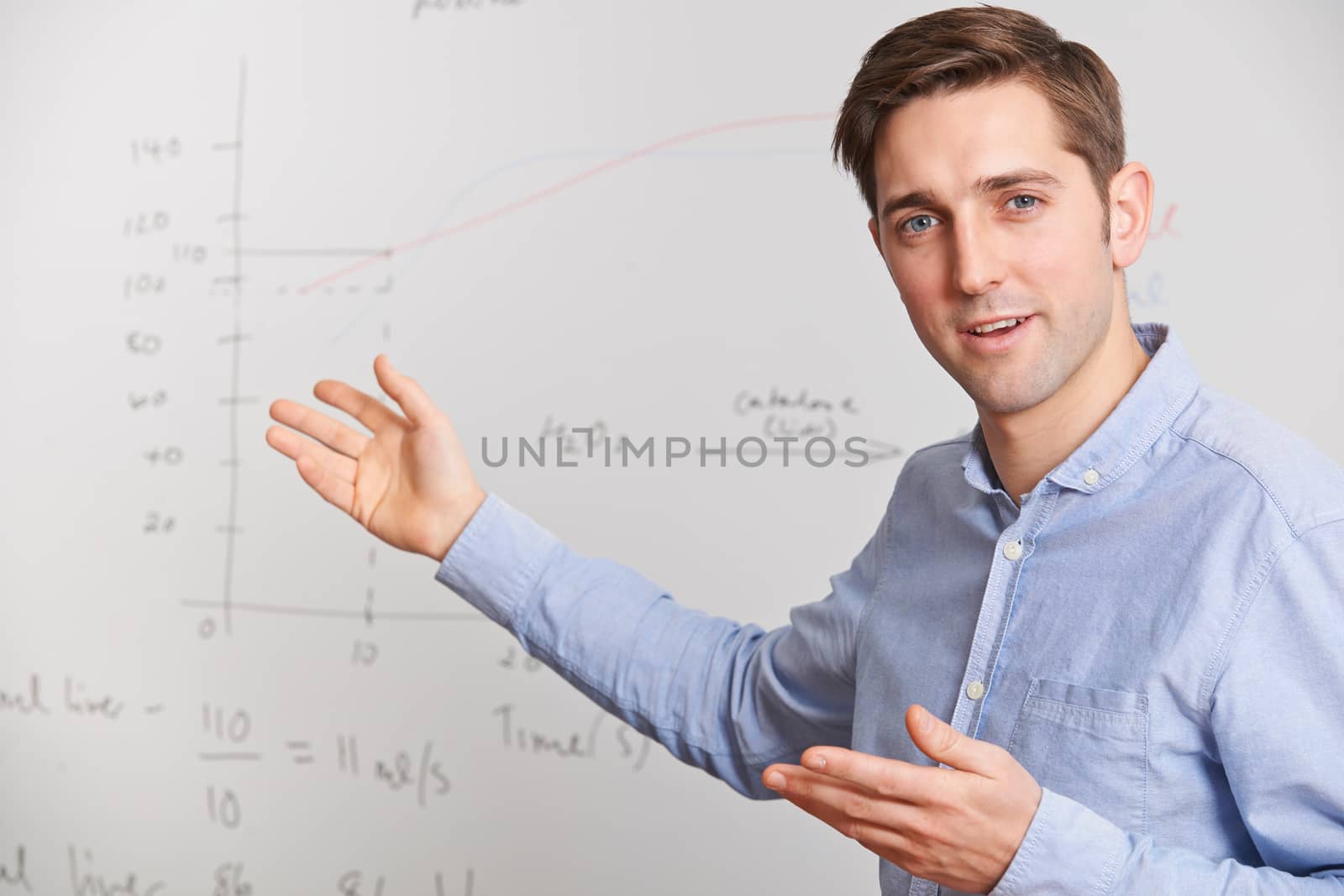 Teacher Standing In Front Of Whiteboard by HWS