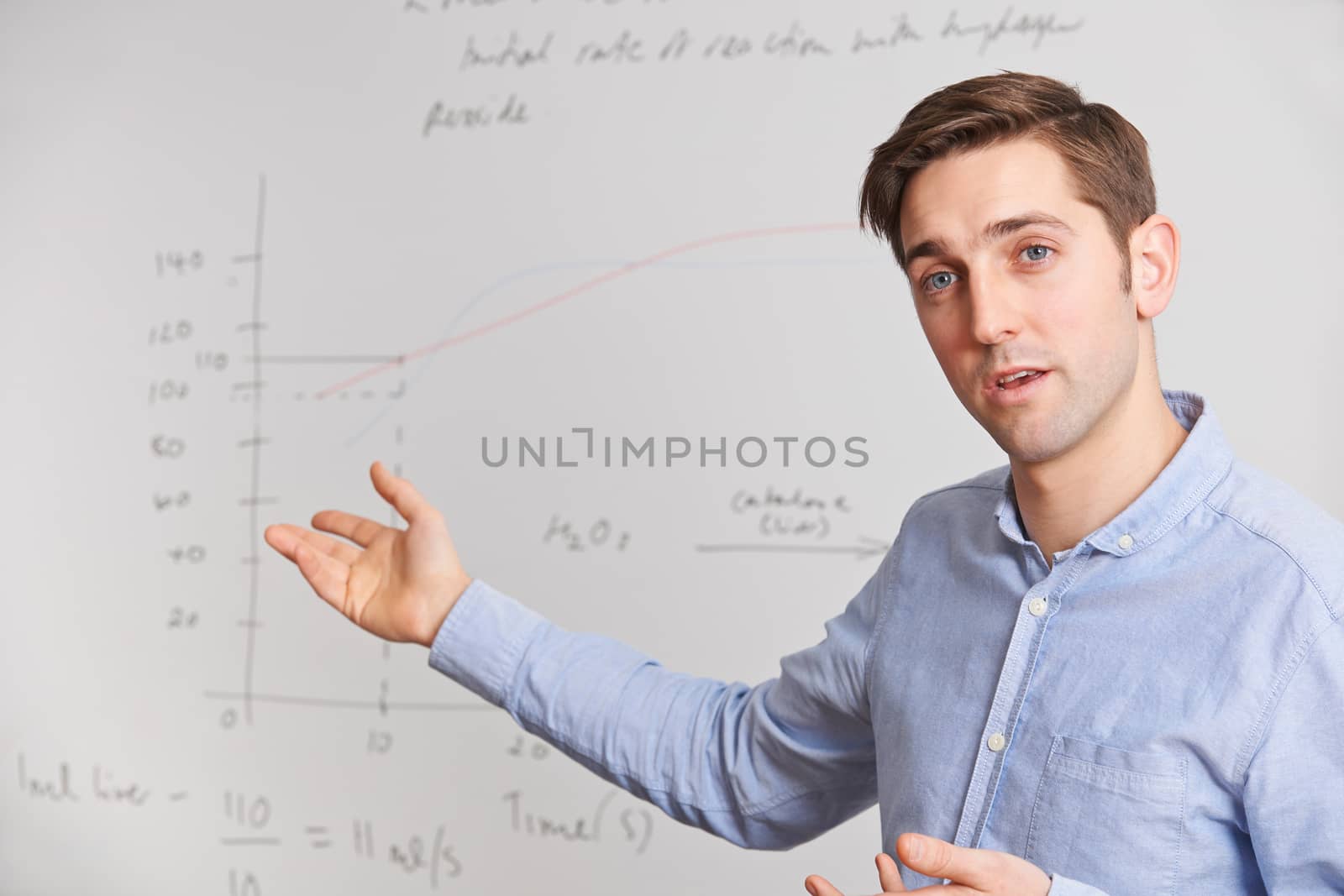 Teacher Standing In Front Of Whiteboard by HWS