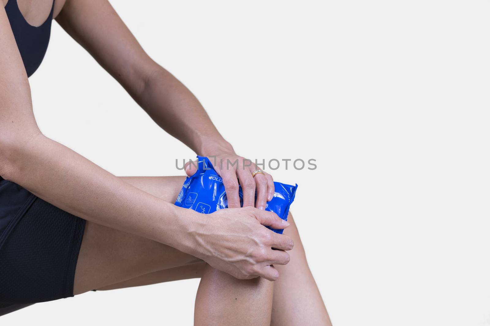 Woman using Cold Instant Pack on her knee by GABIS