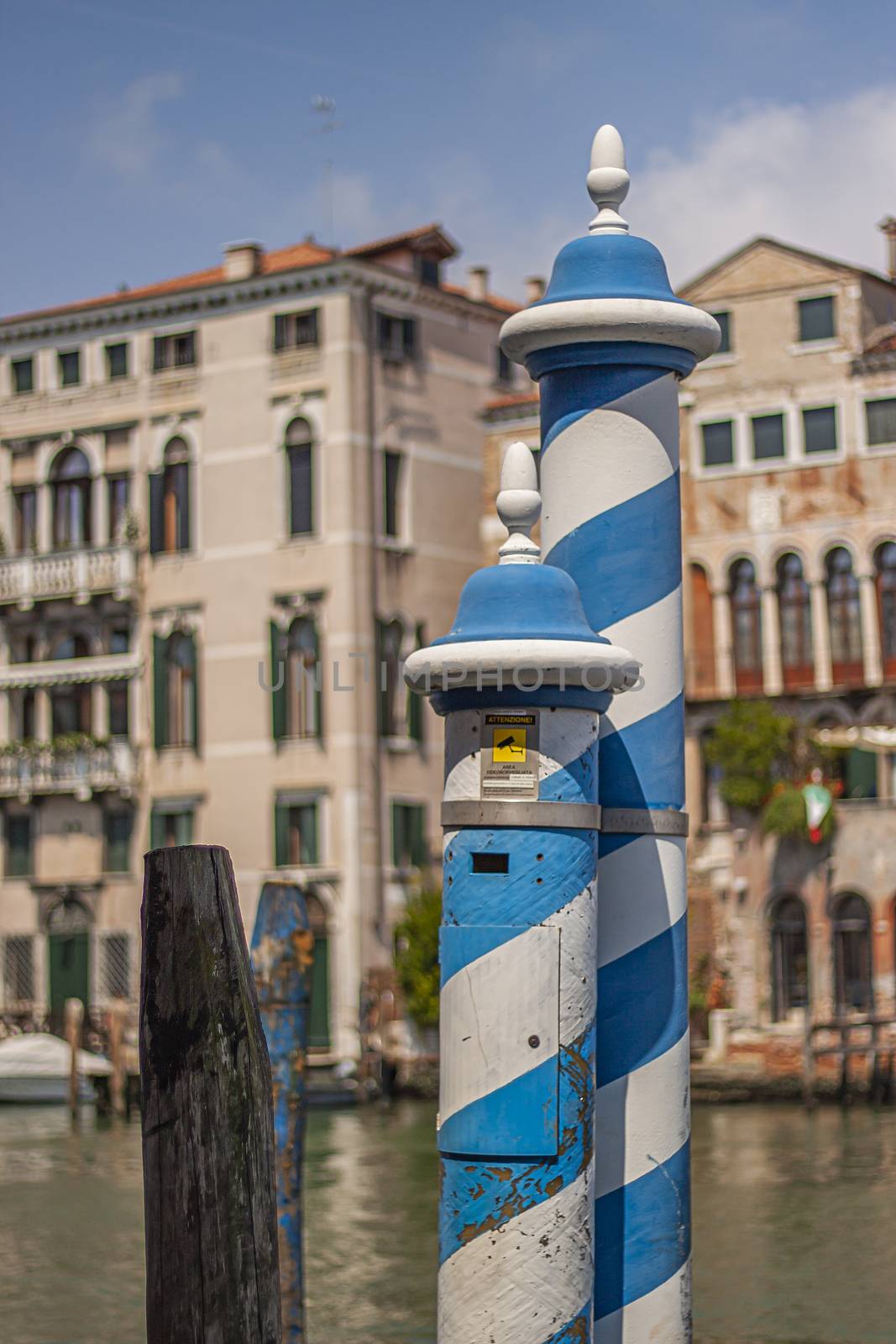 Blue and white Colored pole in Venice, a symbol of Venice
