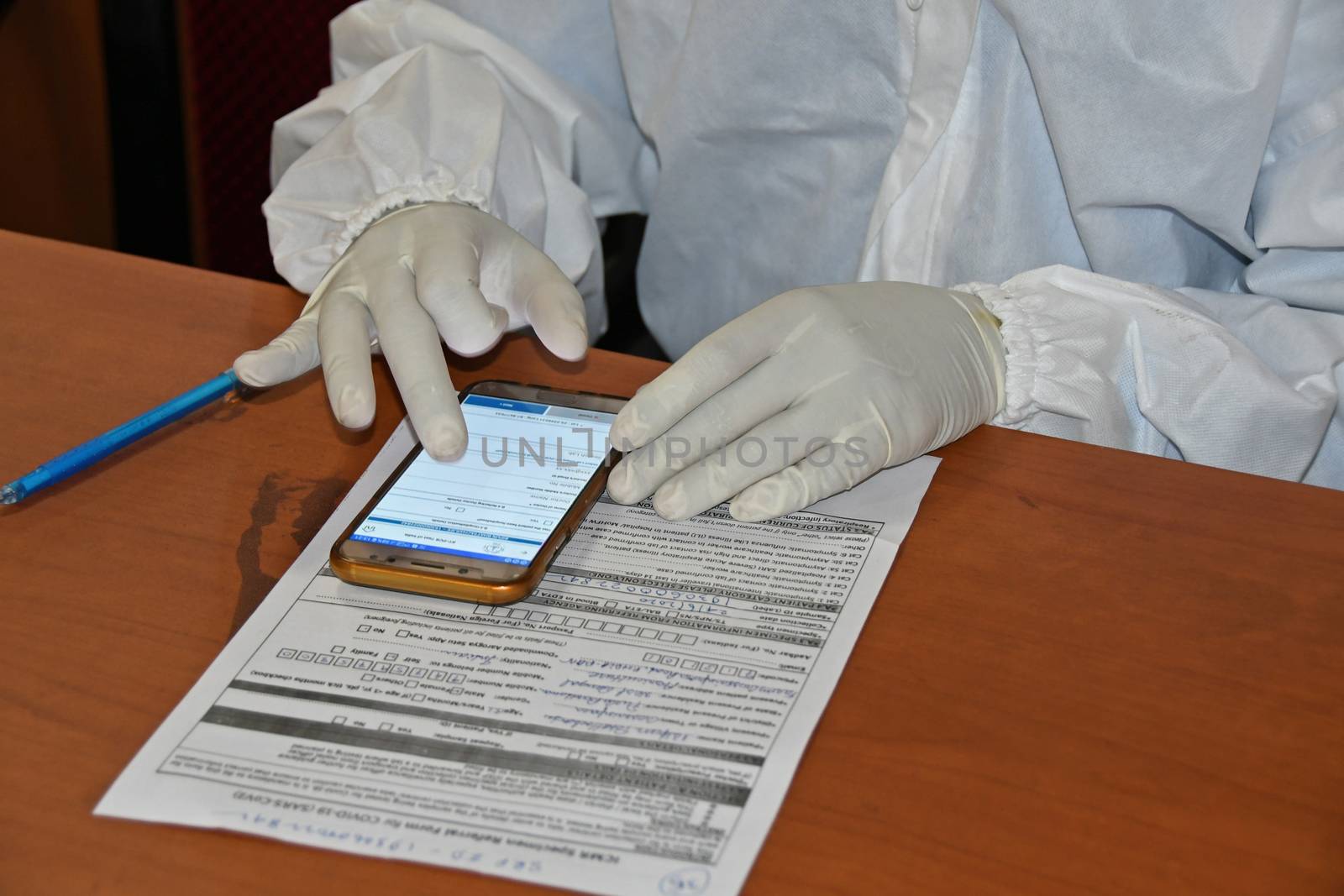 Burdwan Town, Purba Bardhaman District, West Bengal / India - 24.06.2020: Health workers are collecting samples of asymptomatic journalist for COVID-19 (Novel Coronavirus) test in the initiative of Purba Bardhaman District Health Department.