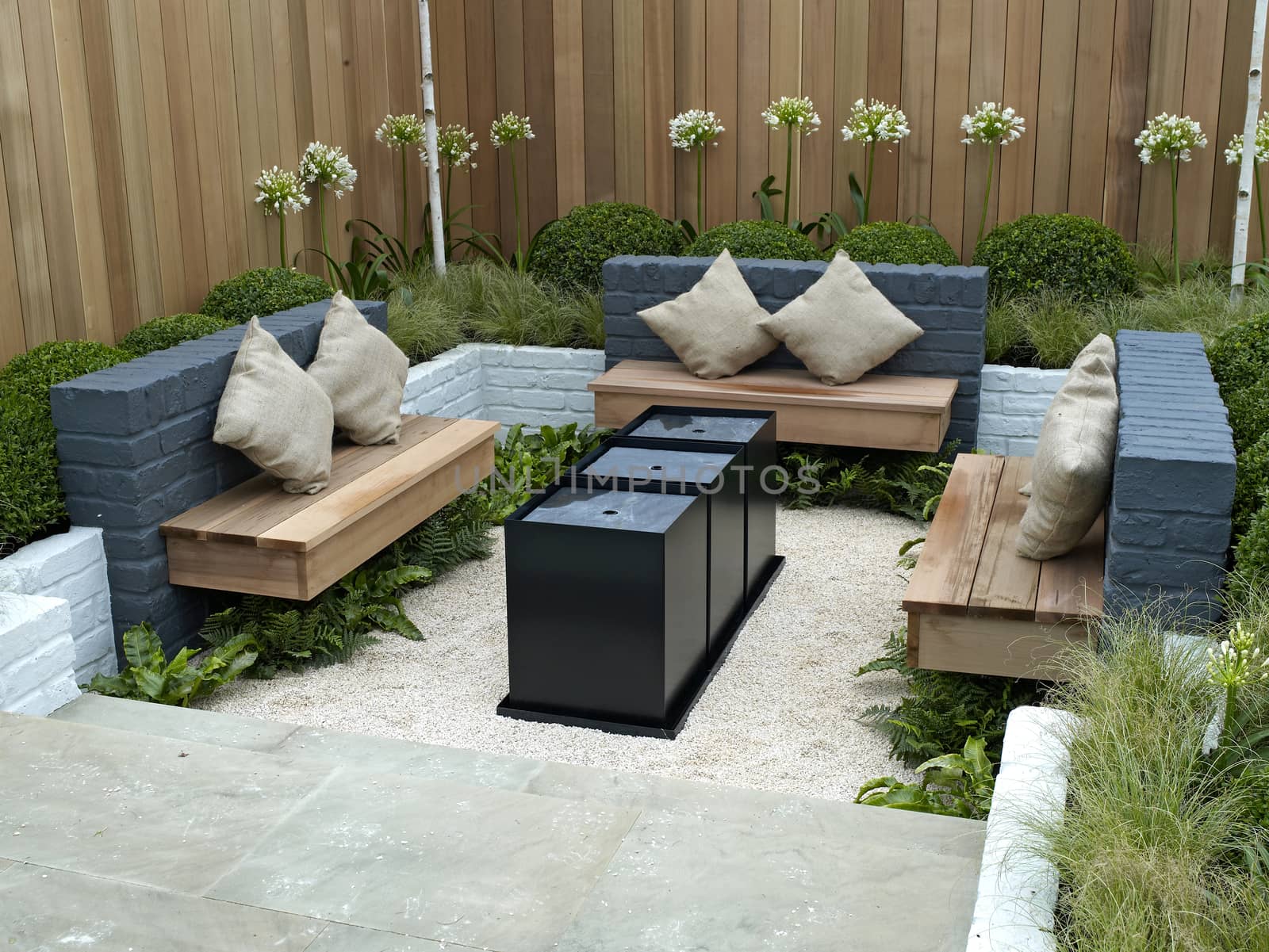 A modern lifestyle garden combining outdoor and indoor living witha sunken seating area