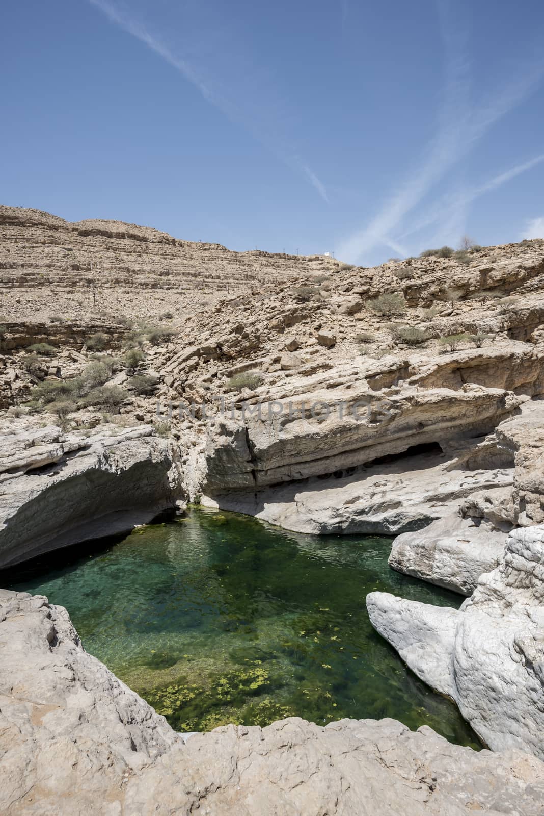 River (with turquoise water) and pool in the canyon of Wadi Bani Khalid, Oman