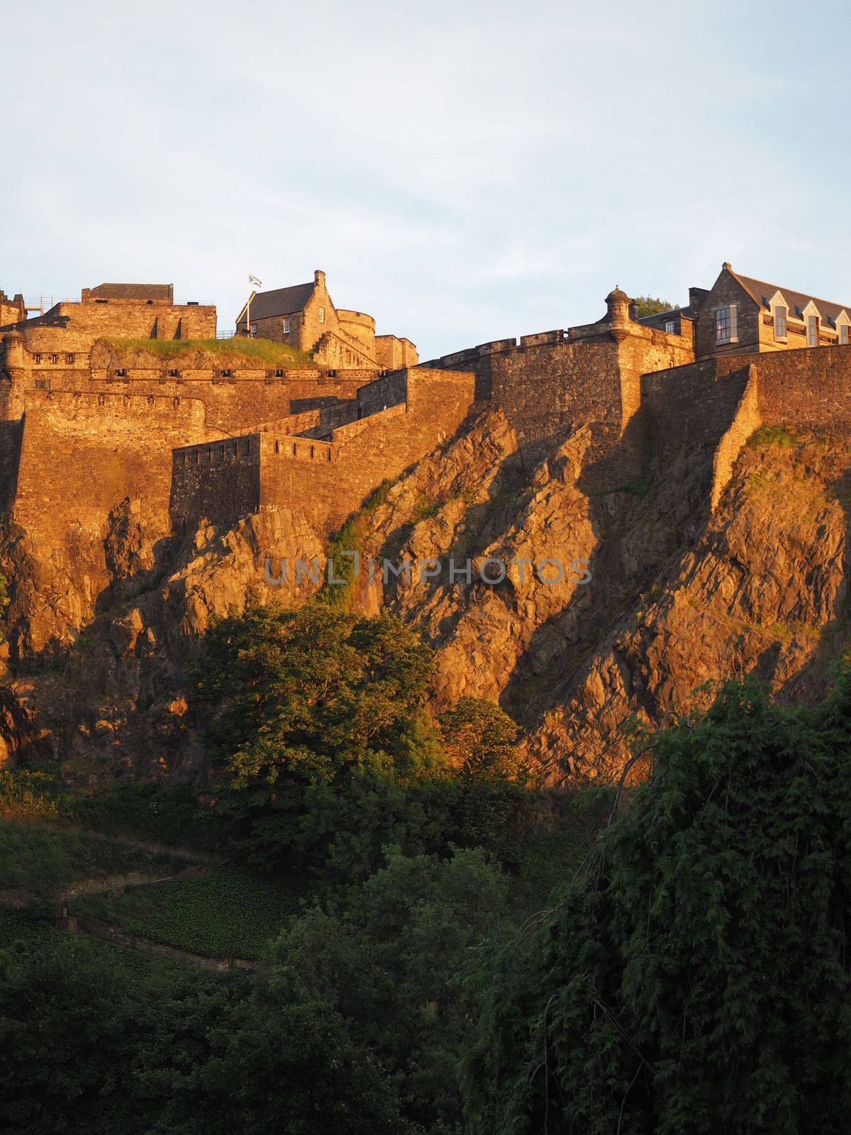 Edinburgh castle at sunset by claudiodivizia