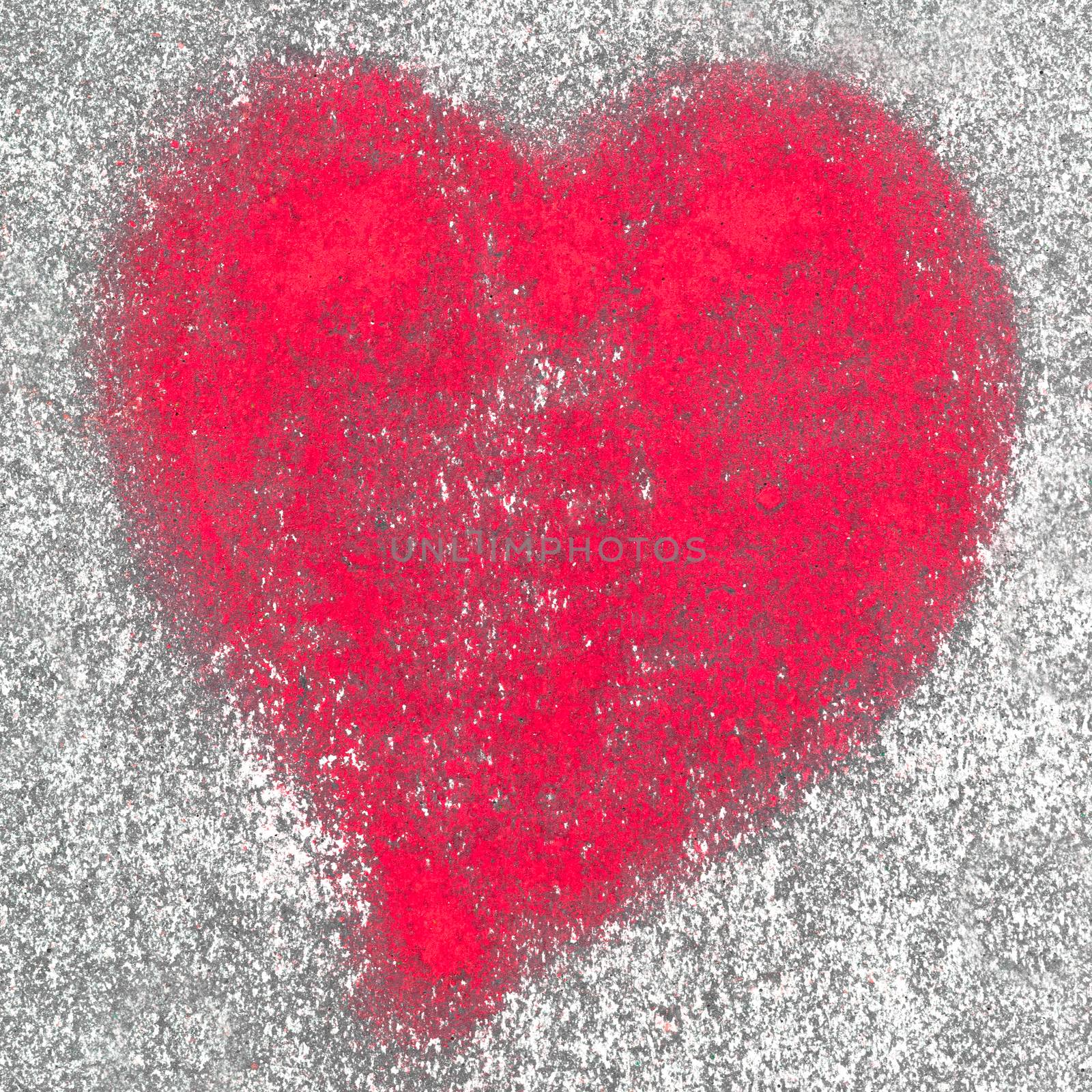 Red heart spray painted on a wall in the background