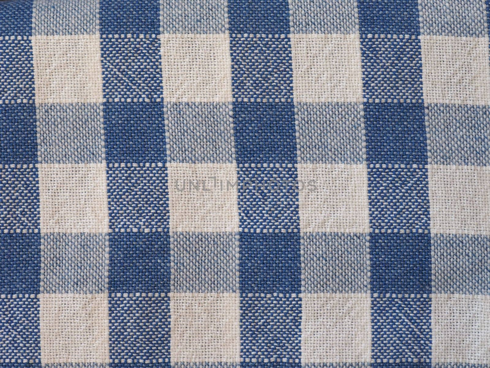blue and white checkered fabric background by claudiodivizia