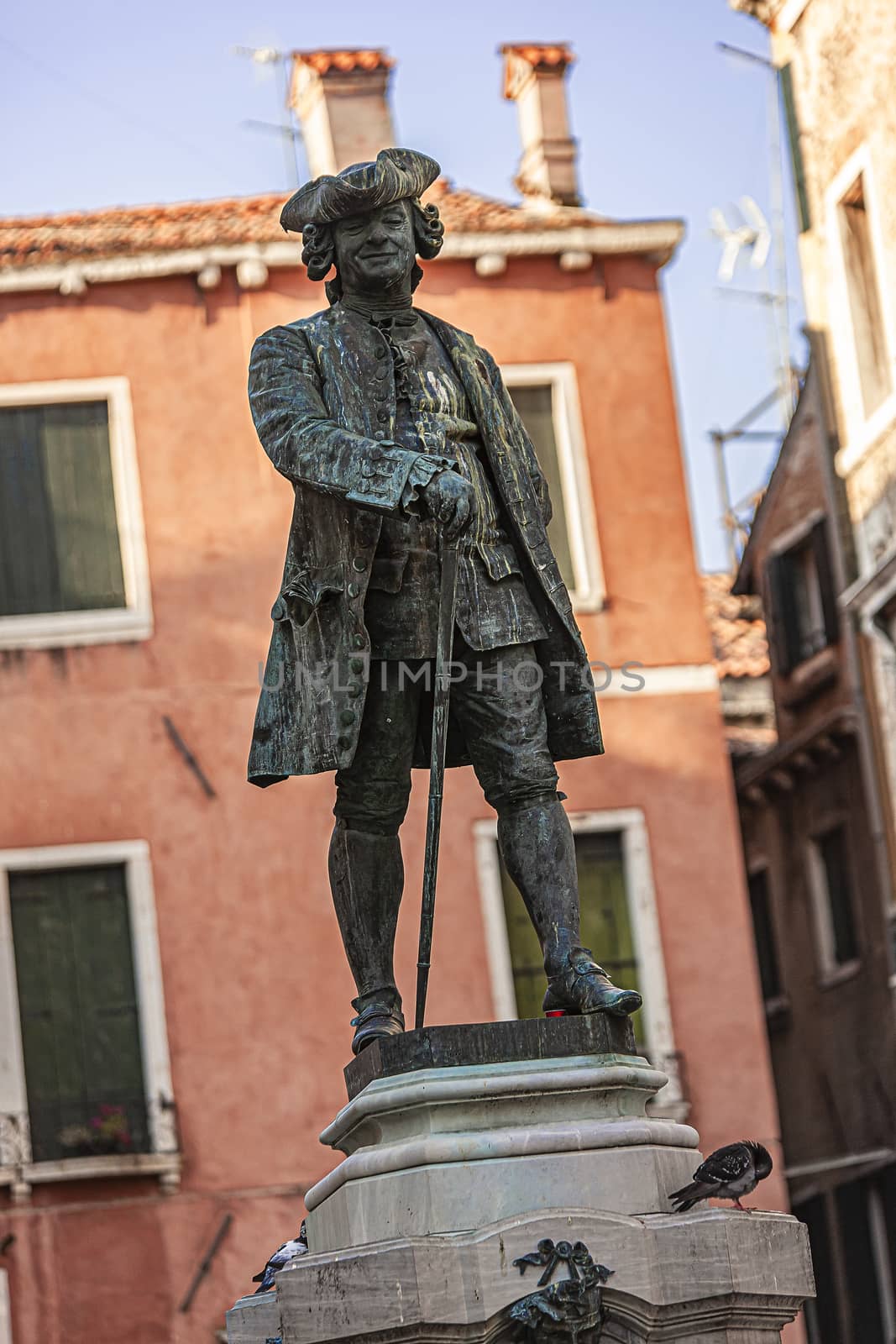 Old and ancient Statue in Venice in Italy during a sunny day