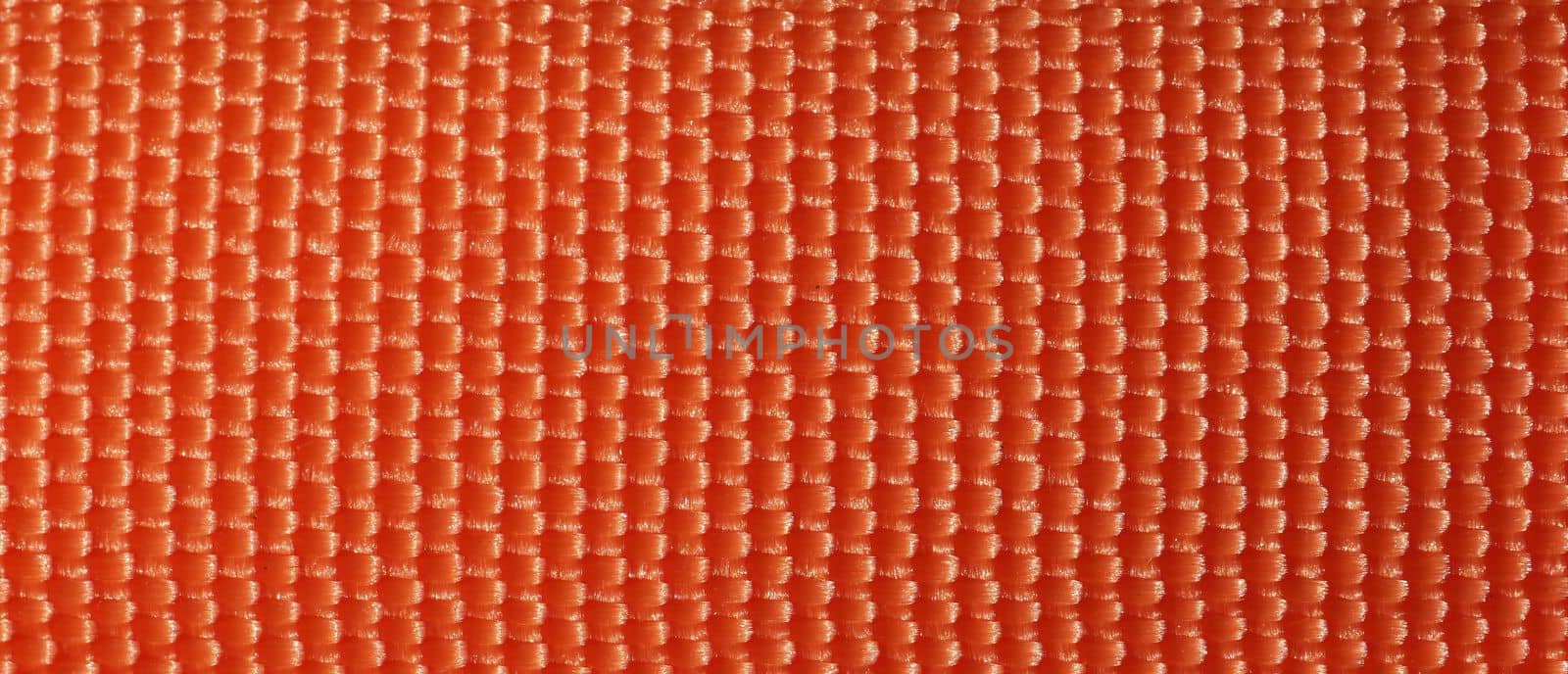 orange fabric texture background by claudiodivizia