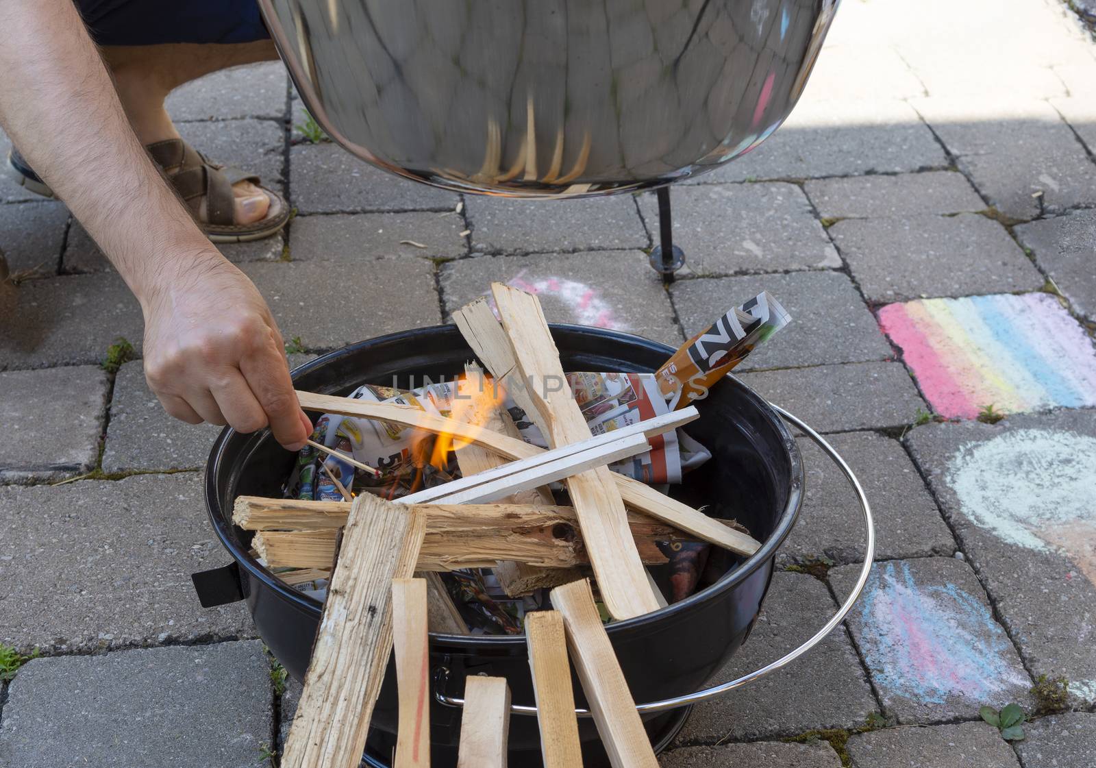 In the open air in the summer in the garden we make a fire to cook food on a fire