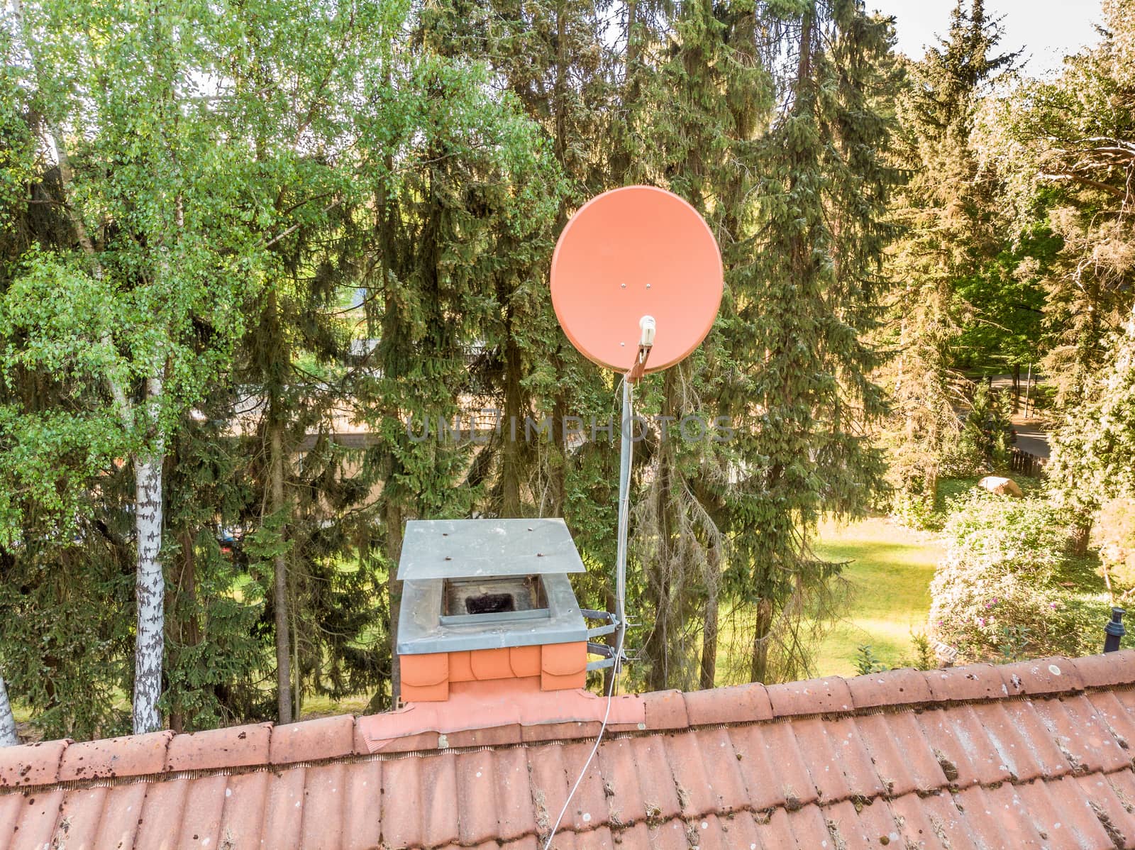 Checking the satellite dish of a house with a drone, aerial photograph, from the roof of a detached house, air intake