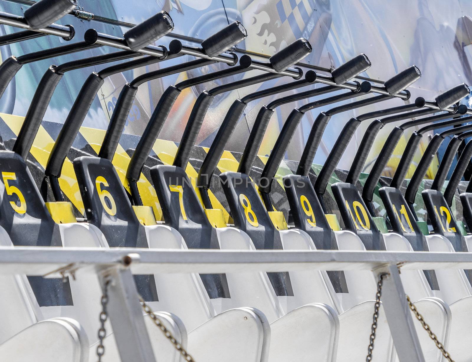 Seats numbered in order on a fairground ride with numbers starting at five, germany