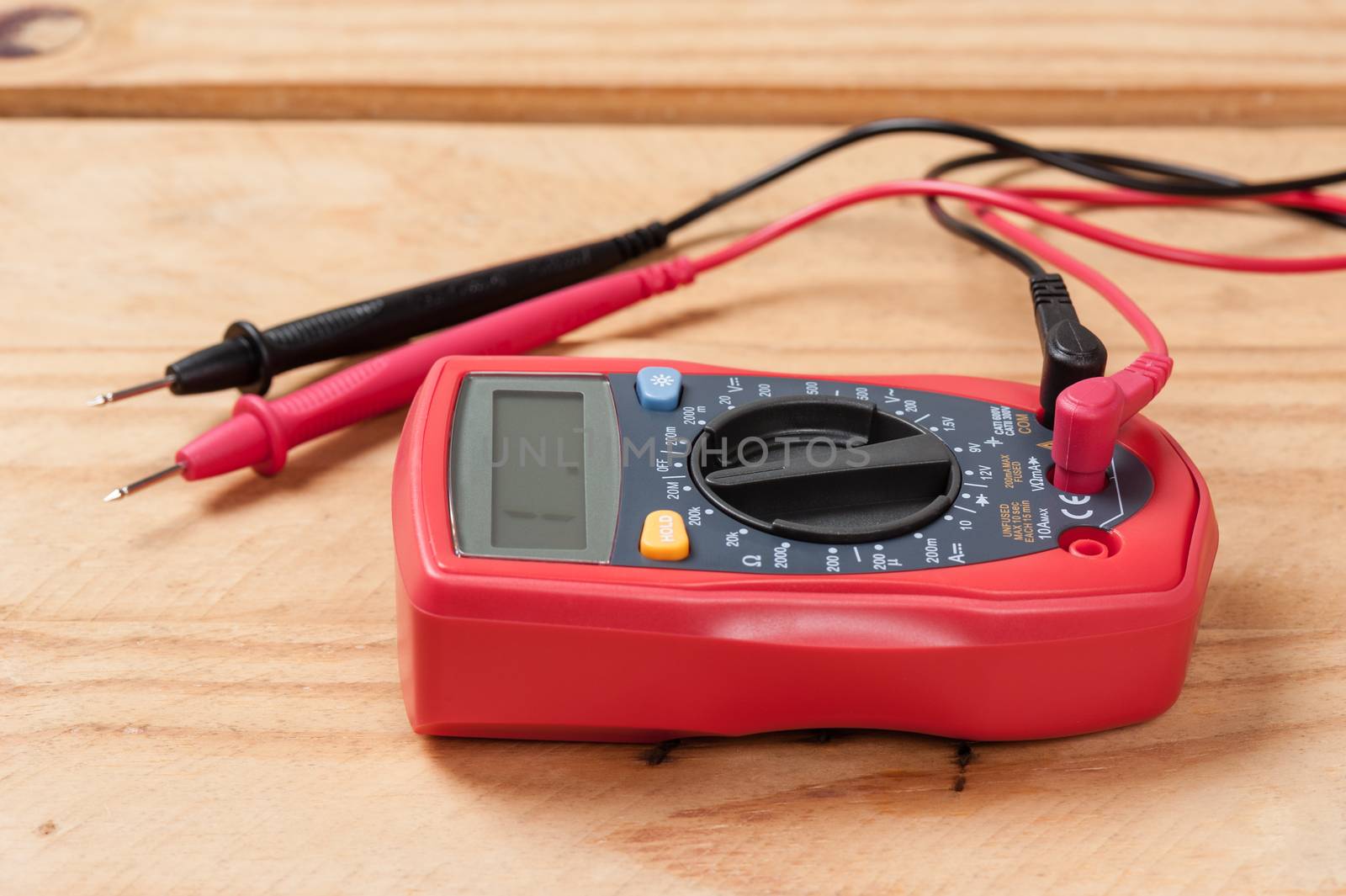 red digital multimeter by norgal