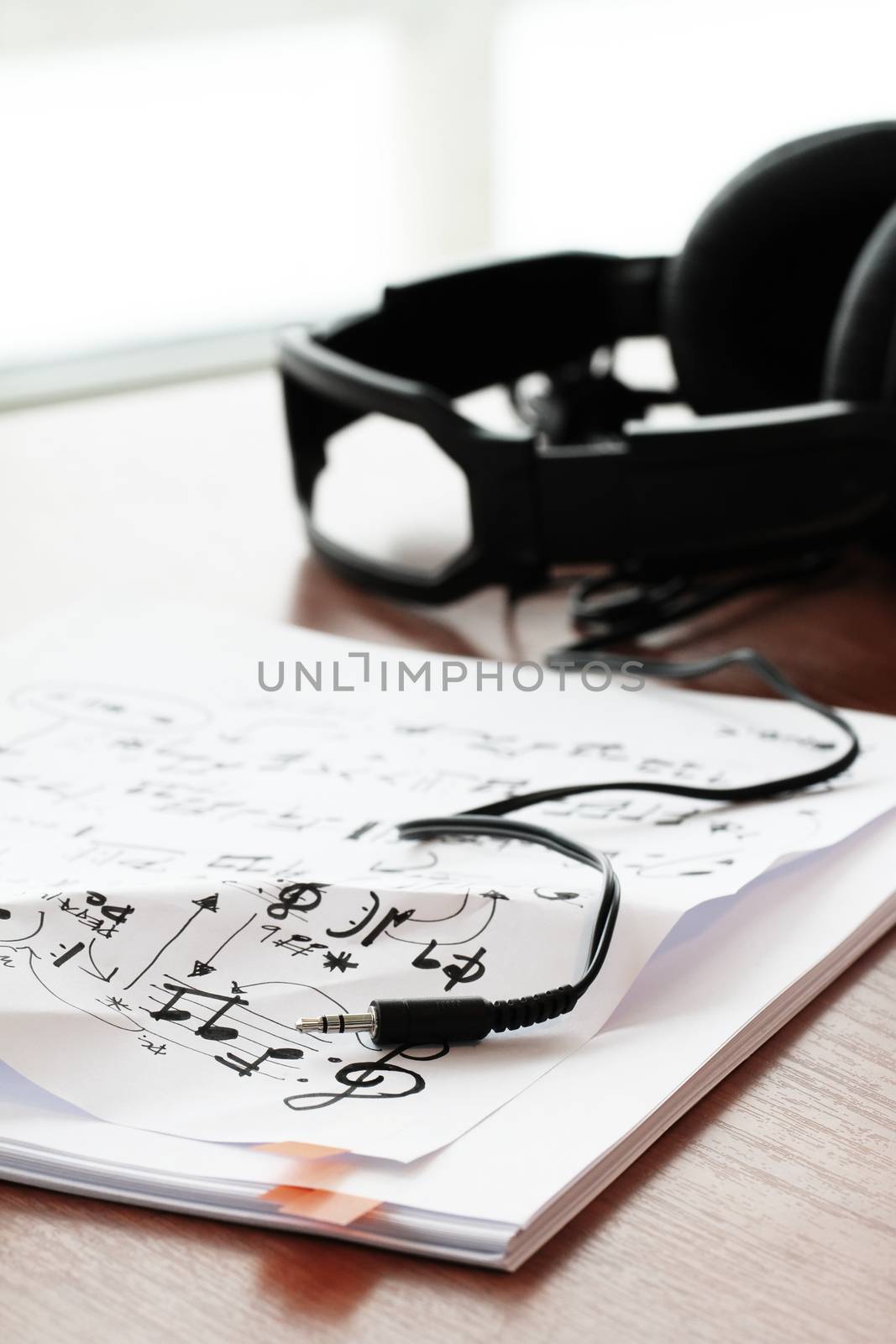 composing music concept with shallow DOF evenly matched jack of headphone and copy space